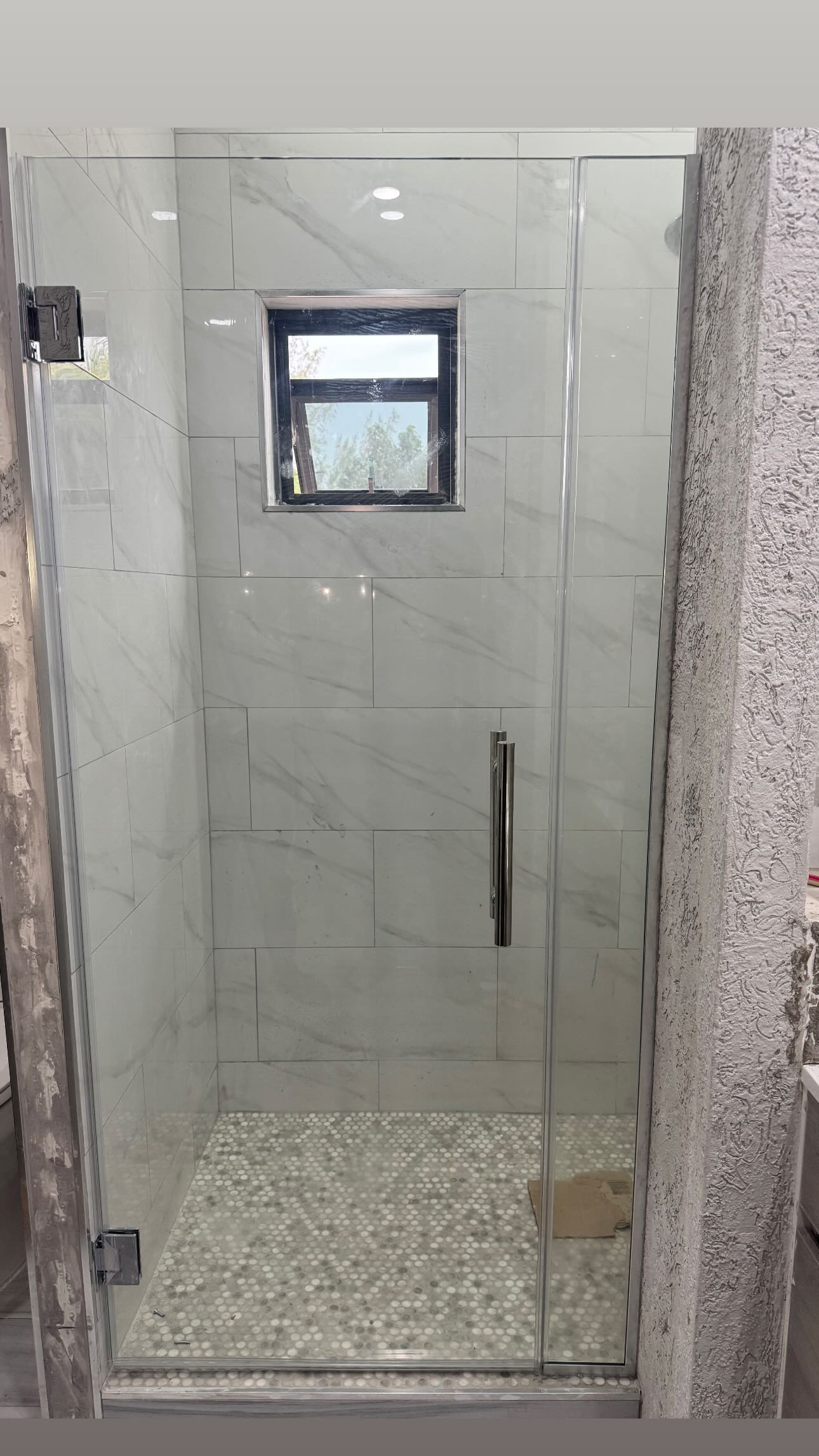 Shower glass that fits Jamaican bathrooms project photo